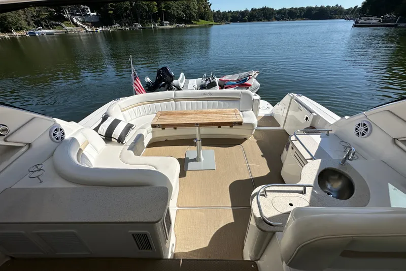  Yacht Photos Pics Luxurious 2009 Sea Ray 48 Sundancer yacht interior with seating, table, and lake view.