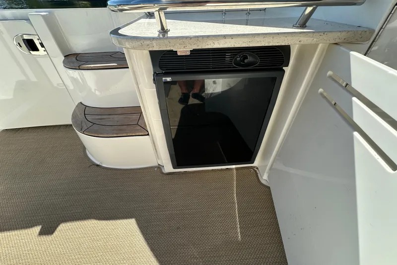  Yacht Photos Pics 2009 Sea Ray 48 Sundancer boat interior with steps and mini fridge.