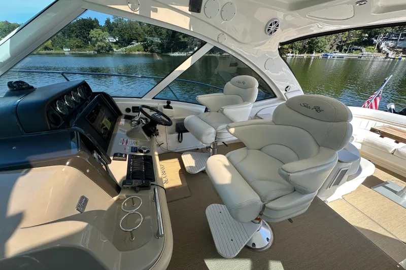  Yacht Photos Pics Luxurious 2009 Sea Ray 48 Sundancer yacht interior with plush seating and scenic lake view.