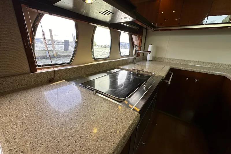  Yacht Photos Pics Luxurious kitchen interior of 2009 Sea Ray 48 Sundancer yacht with modern amenities.