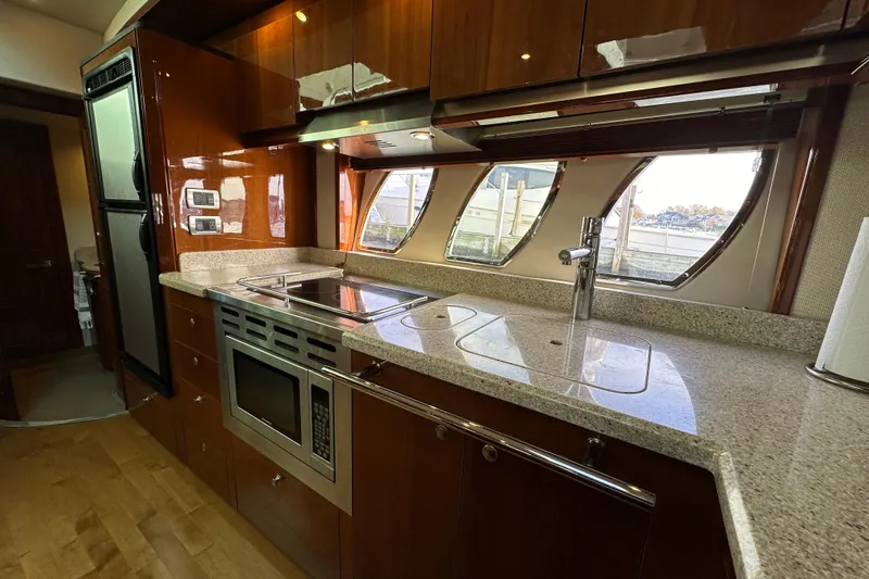  Yacht Photos Pics Luxurious kitchen interior of 2009 Sea Ray 48 Sundancer yacht with modern appliances.