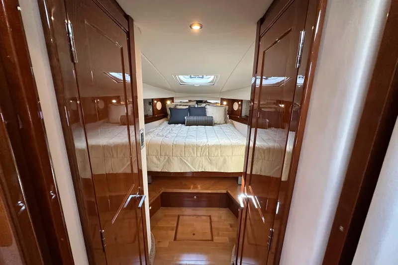  Yacht Photos Pics Luxurious cabin interior of 2009 Sea Ray 48 Sundancer yacht with elegant wood finish.