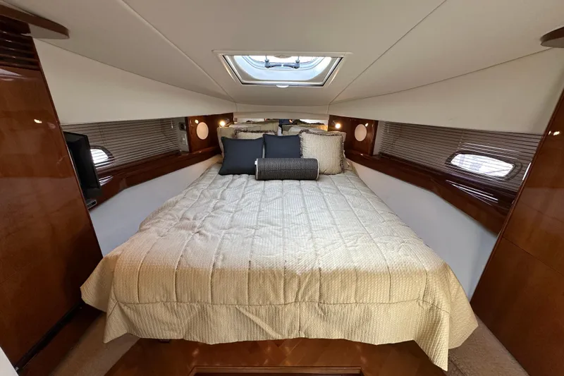 Yacht Photos Pics Luxurious cabin interior of 2009 Sea Ray 48 Sundancer yacht with plush bedding.