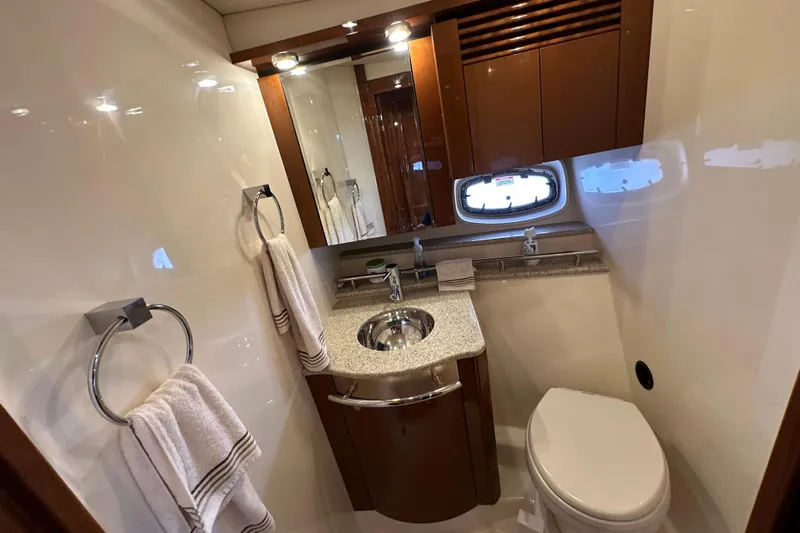  Yacht Photos Pics Luxurious bathroom in 2009 Sea Ray 48 Sundancer yacht with modern fixtures and elegant design.