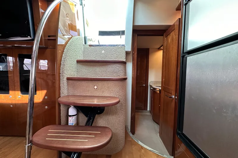 Yacht Photos Pics Interior of 2009 Sea Ray 48 Sundancer yacht with wooden stairs and modern design.