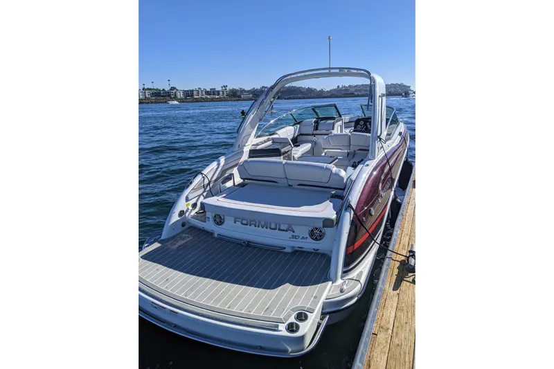  Yacht Photos Pics 2019 Formula 310 Bowrider boat docked on a sunny day.