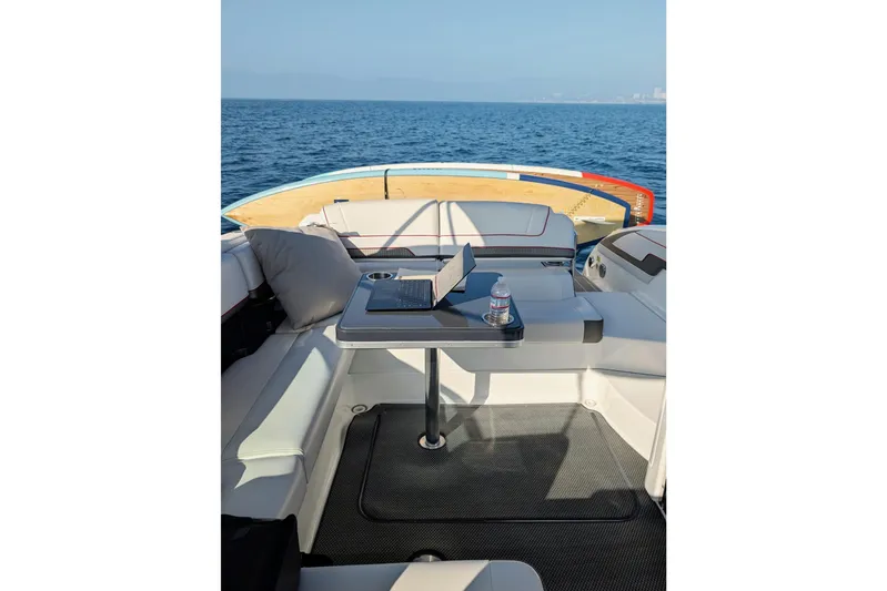  Yacht Photos Pics 2019 Formula 310 Bowrider interior with seating and table on open water.