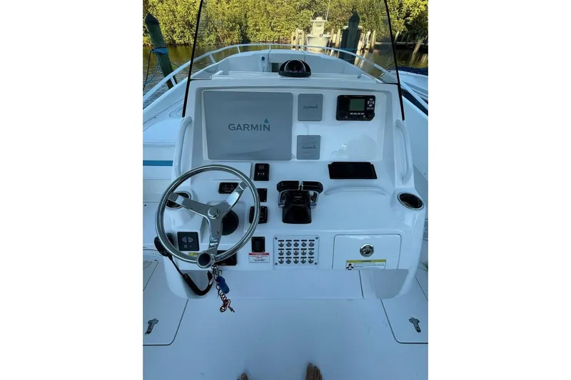 Insignia Yacht Photos Pics 2015 Intrepid 327 Cuddy boat helm with Garmin navigation system and steering wheel.