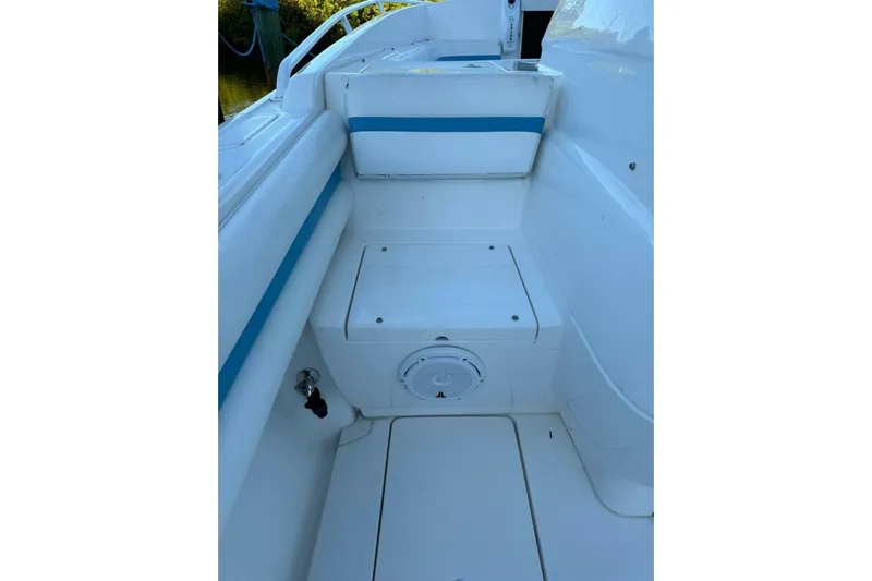 Insignia Yacht Photos Pics 2015 Intrepid 327 Cuddy boat interior with white and blue seating.