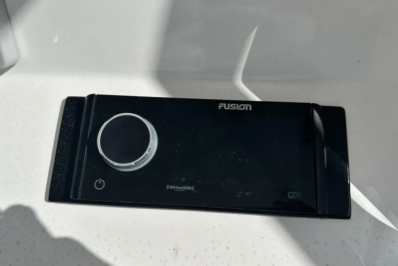 Insignia Yacht Photos Pics Fusion audio system on a 2015 Intrepid 327 Cuddy boat dashboard.