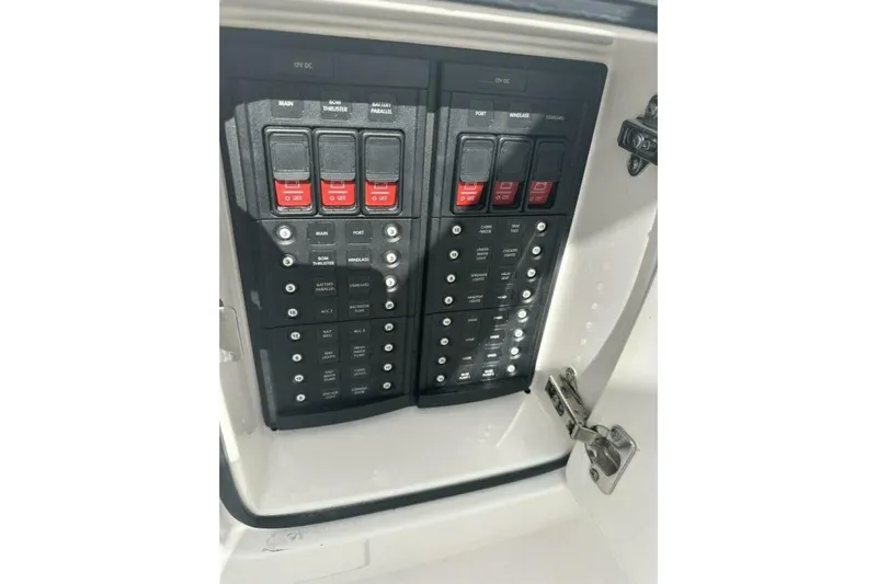 Insignia Yacht Photos Pics Control panel of a 2015 Intrepid 327 Cuddy boat, featuring switches and circuit breakers.