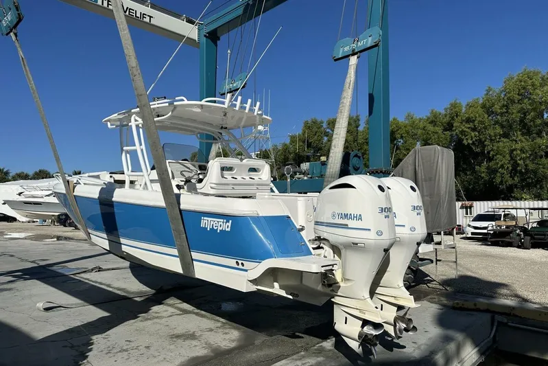 Insignia Yacht Photos Pics 2015 Intrepid 327 Cuddy boat with Yamaha engines on a lift.