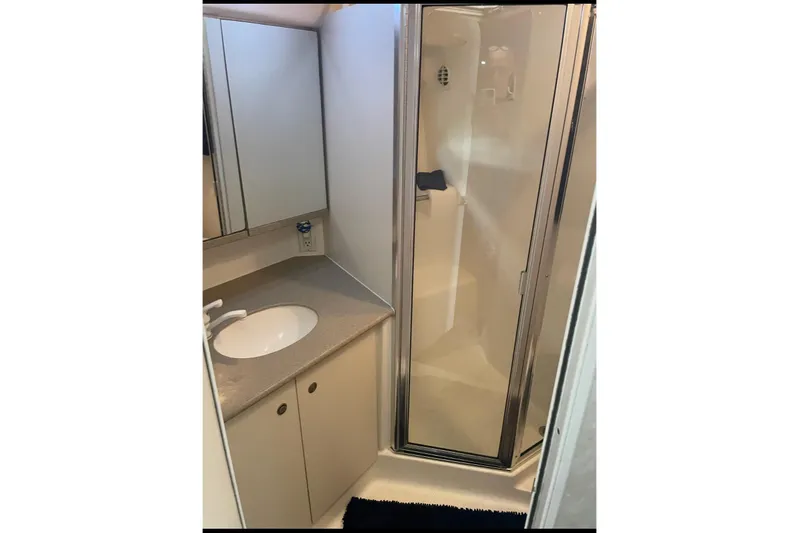 Living The Dream Yacht Photos Pics Bathroom interior of 1997 Silverton 402 Motor Yacht with shower and sink.