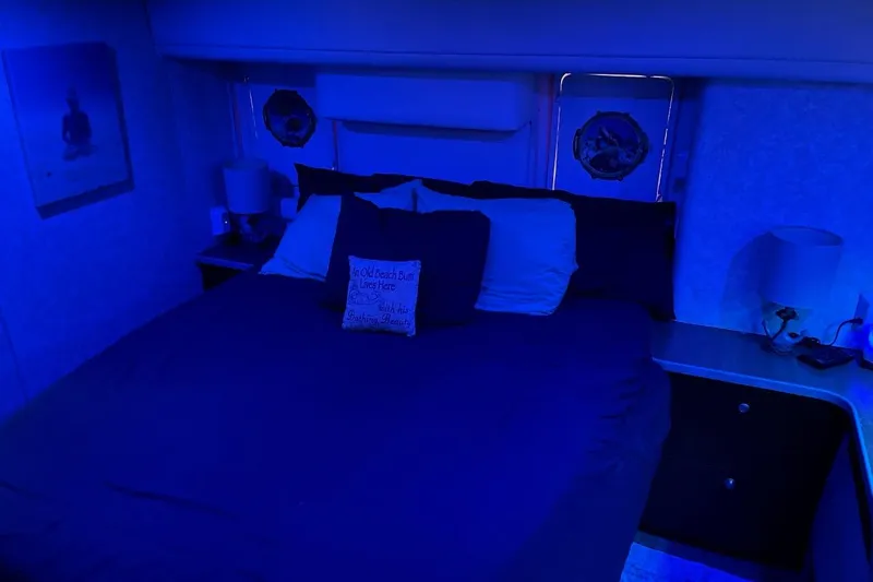 Living The Dream Yacht Photos Pics Cozy bedroom with blue lighting in a 1997 Silverton 402 Motor Yacht.