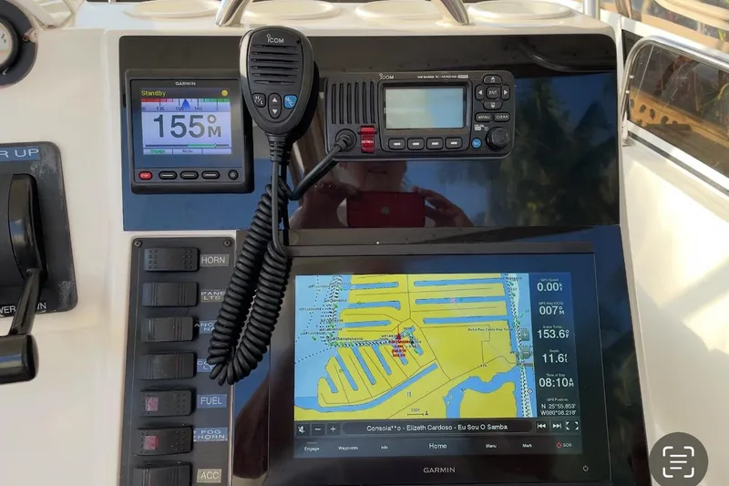 Living The Dream Yacht Photos Pics Control panel of a 1997 Silverton 402 Motor Yacht with navigation and communication equipment.