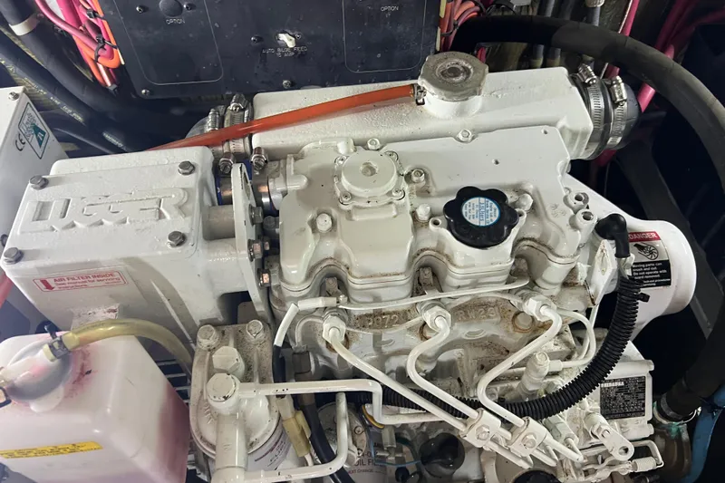 Living The Dream Yacht Photos Pics Engine of a 1997 Silverton 402 Motor Yacht, showcasing mechanical components and wiring.