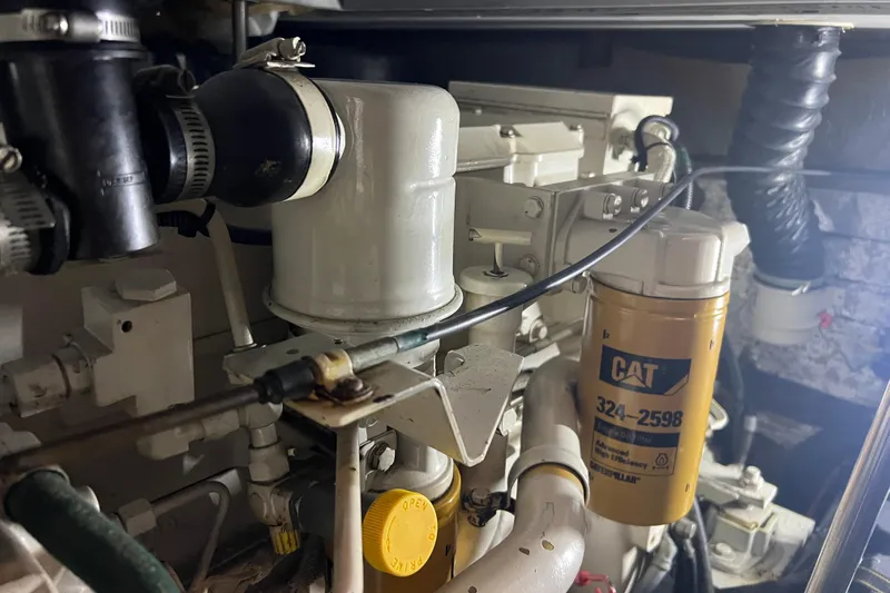Living The Dream Yacht Photos Pics Engine compartment of a 1997 Silverton 402 Motor Yacht with CAT filter.
