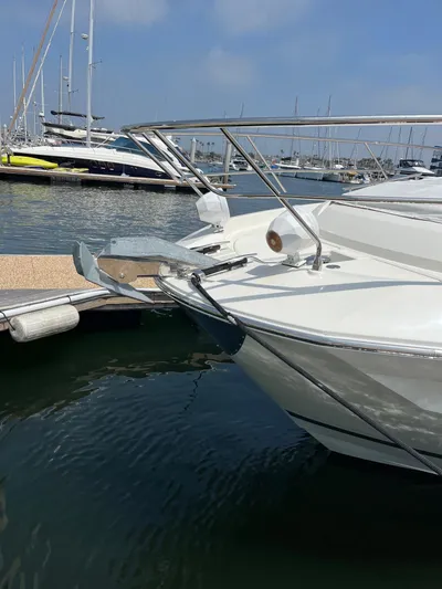 Simorgh Yacht Photos Pics 2019 Prestige 460 yacht docked at a marina with other boats.