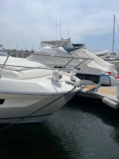Simorgh Yacht Photos Pics 2019 Prestige 460 yacht docked at a marina.