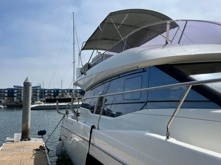 Simorgh Yacht Photos Pics 2019 Prestige 460 yacht docked at marina on a sunny day.