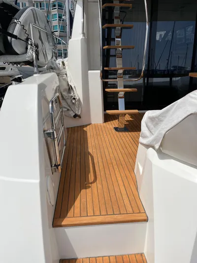Simorgh Yacht Photos Pics Prestige 460 yacht 2019 model, teak deck with steps leading to upper deck.