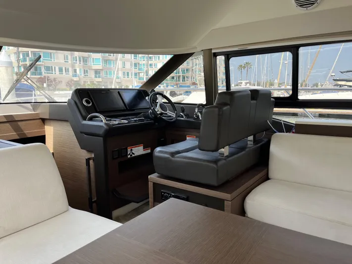 Simorgh Yacht Photos Pics Interior of a 2019 Prestige 460 yacht with modern helm and seating.