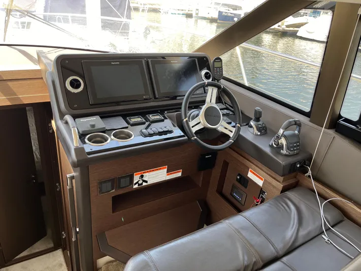Simorgh Yacht Photos Pics Prestige 460 2019 yacht helm station with dual screens and leather seating.