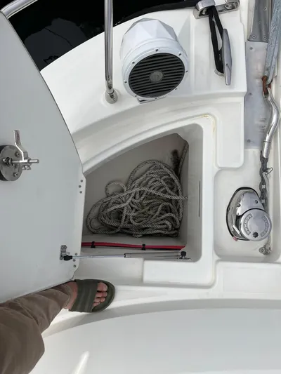Simorgh Yacht Photos Pics 2019 Prestige 460 yacht deck with storage compartment and coiled rope.