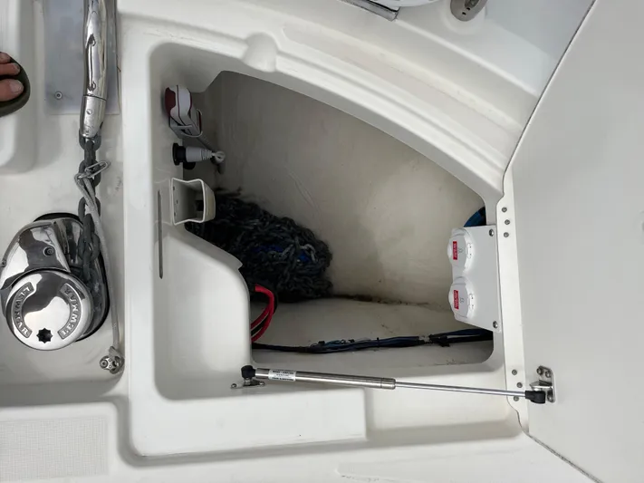 Simorgh Yacht Photos Pics Prestige 460 2019 boat storage compartment with anchor chain and battery switches.