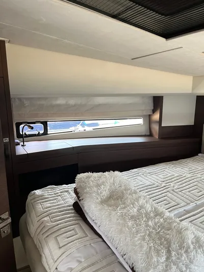 Simorgh Yacht Photos Pics Luxurious bedroom interior of a 2019 Prestige 460 yacht with modern furnishings.