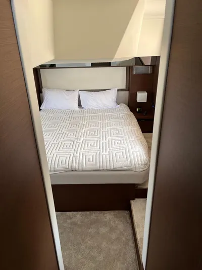 Simorgh Yacht Photos Pics Luxurious bedroom in a 2019 Prestige 460 yacht with modern decor.