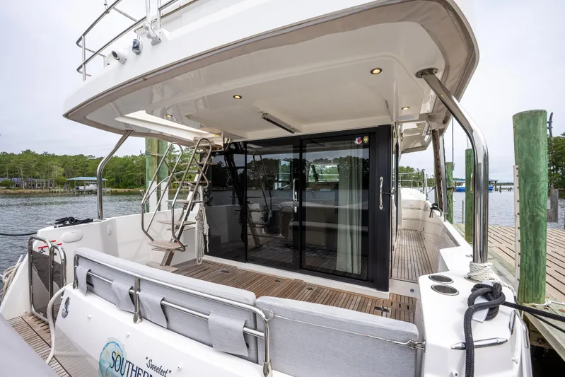 Sweetest Southern Comfort Yacht Photos Pics 2022 Beneteau ST48 Swift Trawler 48 docked, featuring spacious deck and modern design.