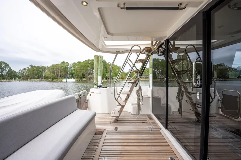 Sweetest Southern Comfort Yacht Photos Pics 2022 Beneteau ST48 Swift Trawler 48 deck with seating and water view.