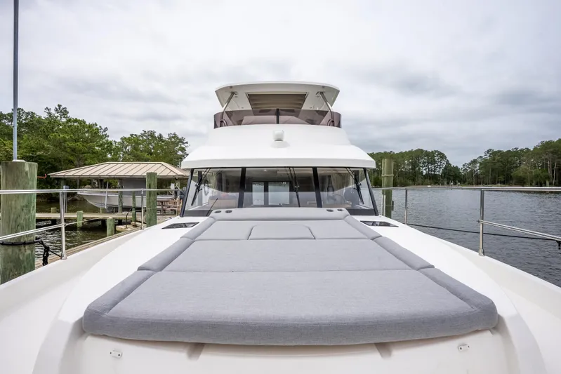Sweetest Southern Comfort Yacht Photos Pics 2022 Beneteau ST48 Swift Trawler 48 on water, featuring spacious deck and modern design.