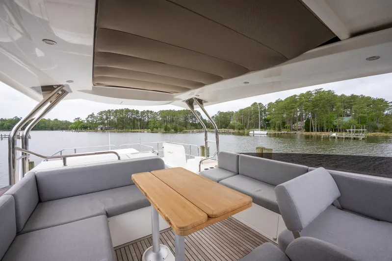 Sweetest Southern Comfort Yacht Photos Pics 2022 Beneteau ST48 Swift Trawler 48, featuring a spacious outdoor seating area by the water.