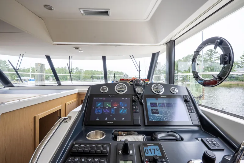 Sweetest Southern Comfort Yacht Photos Pics Interior helm of 2022 Beneteau ST48 Swift Trawler 48 with modern navigation displays.