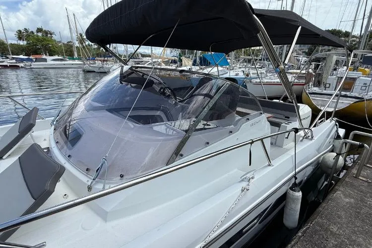 P'tit Bateau Yacht Photos Pics 2022 Jeanneau Cap Camarat 9.0 WA boat docked at marina with canopy and sleek design.