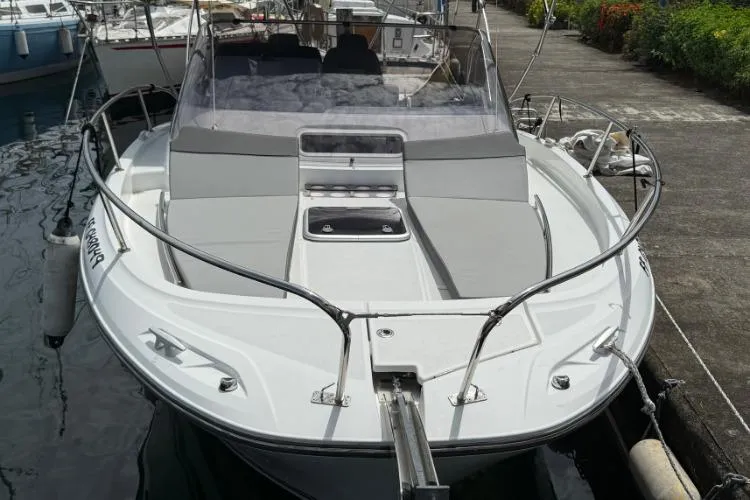 P'tit Bateau Yacht Photos Pics 2022 Jeanneau Cap Camarat 9.0 WA boat docked at marina, front view.