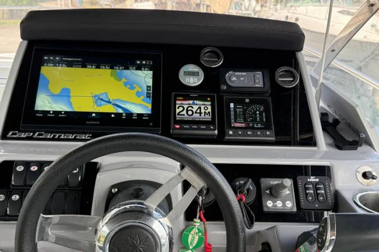 P'tit Bateau Yacht Photos Pics Cockpit of 2022 Jeanneau Cap Camarat 9.0 WA with navigation and control systems.