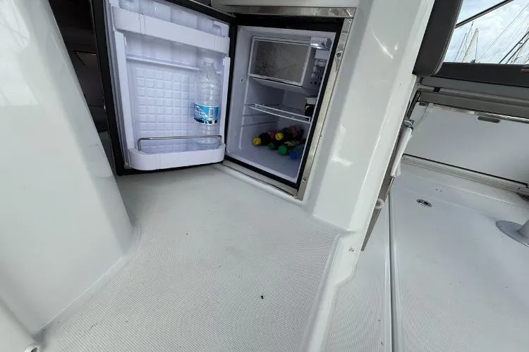 P'tit Bateau Yacht Photos Pics Open mini fridge on Jeanneau Cap Camarat 9.0 WA boat, 2022 model.
