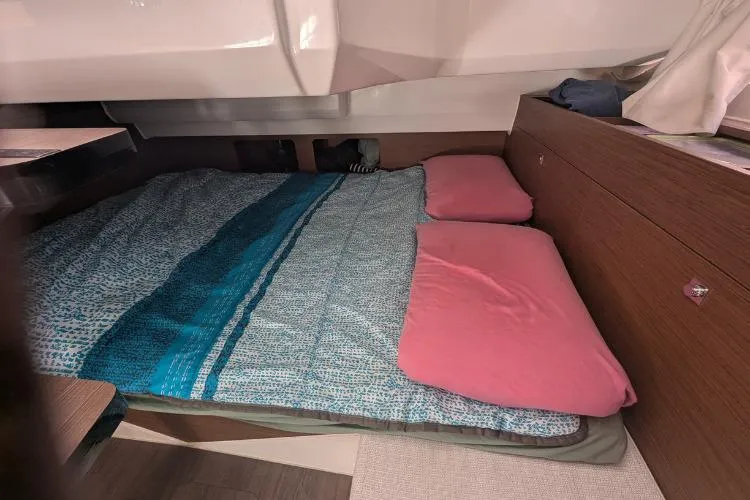 P'tit Bateau Yacht Photos Pics Interior cabin of 2022 Jeanneau Cap Camarat 9.0 wa with cozy bedding.