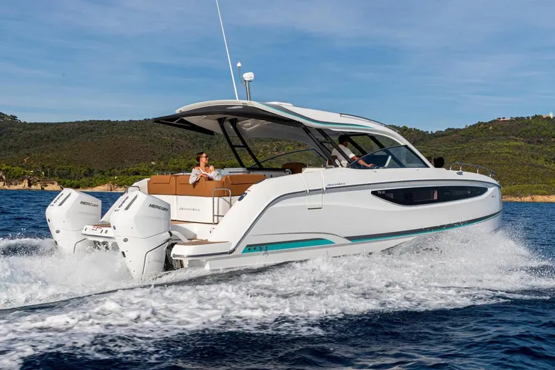  Yacht Photos Pics Manufacturer Provided Image: 2026 Jeanneau TH38 motor yacht cruising on open water with scenic background.