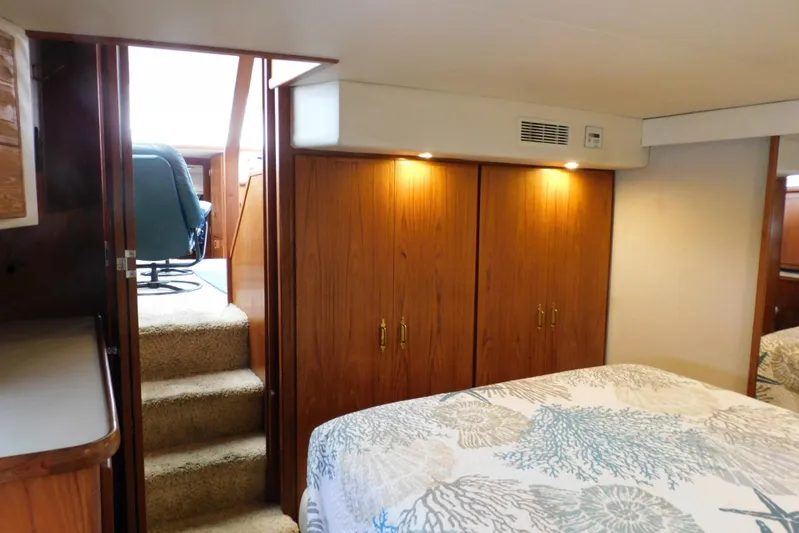 La Vida Yacht Photos Pics Interior of 1993 Carver 445 Aft Cabin Motor Yacht with wooden cabinets and cozy decor.