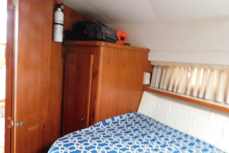 La Vida Yacht Photos Pics Cozy cabin interior of 1993 Carver 445 Aft Cabin Motor Yacht with wooden cabinetry.