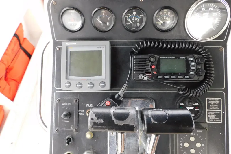 La Vida Yacht Photos Pics Control panel of 1993 Carver 445 Aft Cabin Motor Yacht with gauges and radio equipment.