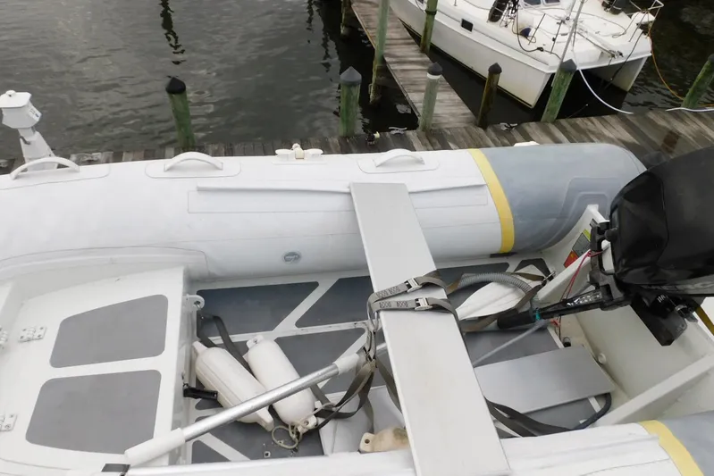 La Vida Yacht Photos Pics Inflatable boat on dock near Carver 445 Aft Cabin Motor Yacht, 1993 model.