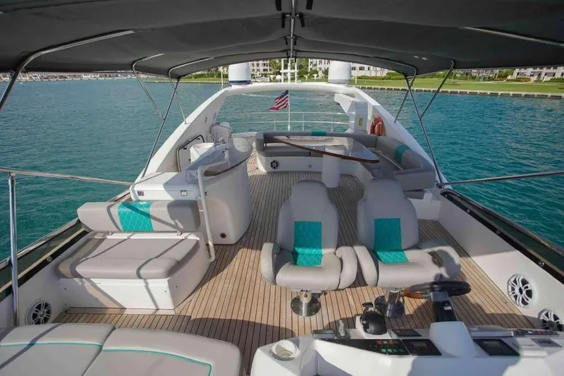 Fins Up Yacht Photos Pics Luxurious 2006 Sunseeker Manhattan Motor 82 yacht interior with elegant seating and ocean view.