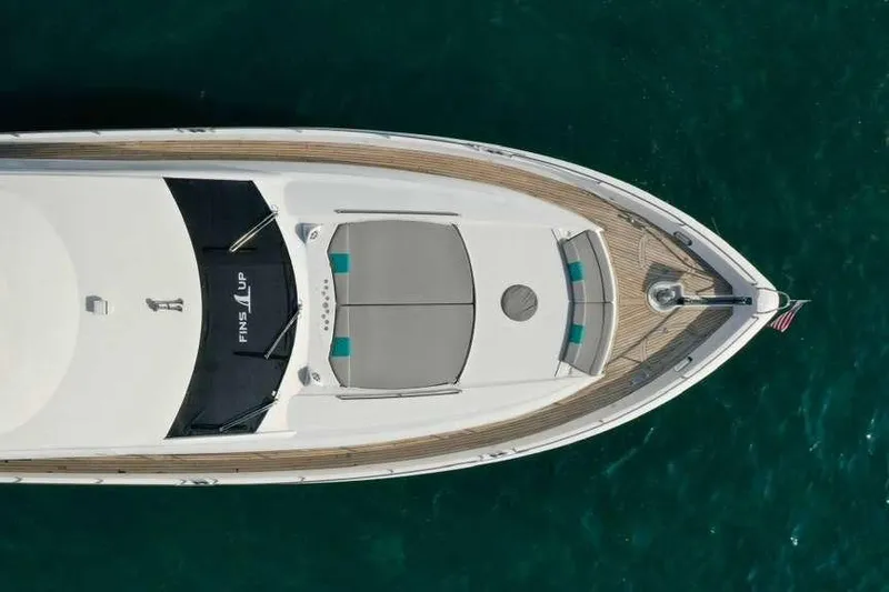Fins Up Yacht Photos Pics Top view of 2006 Sunseeker Manhattan Motor 82 yacht on blue water.