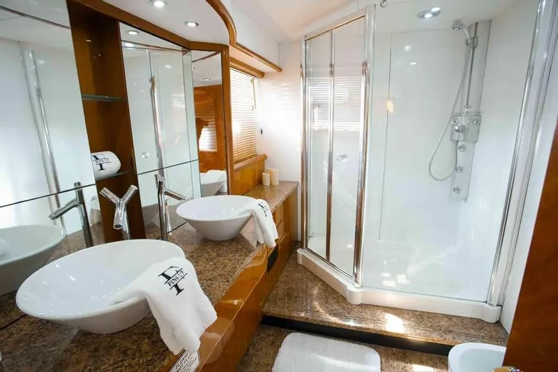 Fins Up Yacht Photos Pics Luxurious bathroom in 2006 Sunseeker Manhattan Motor 82 yacht with modern fixtures and shower.