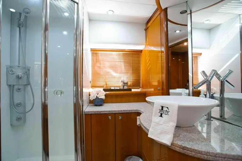 Fins Up Yacht Photos Pics Luxurious bathroom in 2006 Sunseeker Manhattan Motor 82 yacht with modern fixtures.